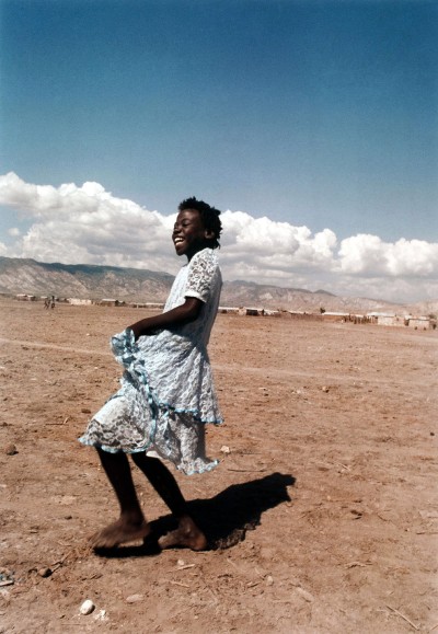 Girl laughing in Rabato, a slum just outside Gonaives, Haiti, Maggie Steber